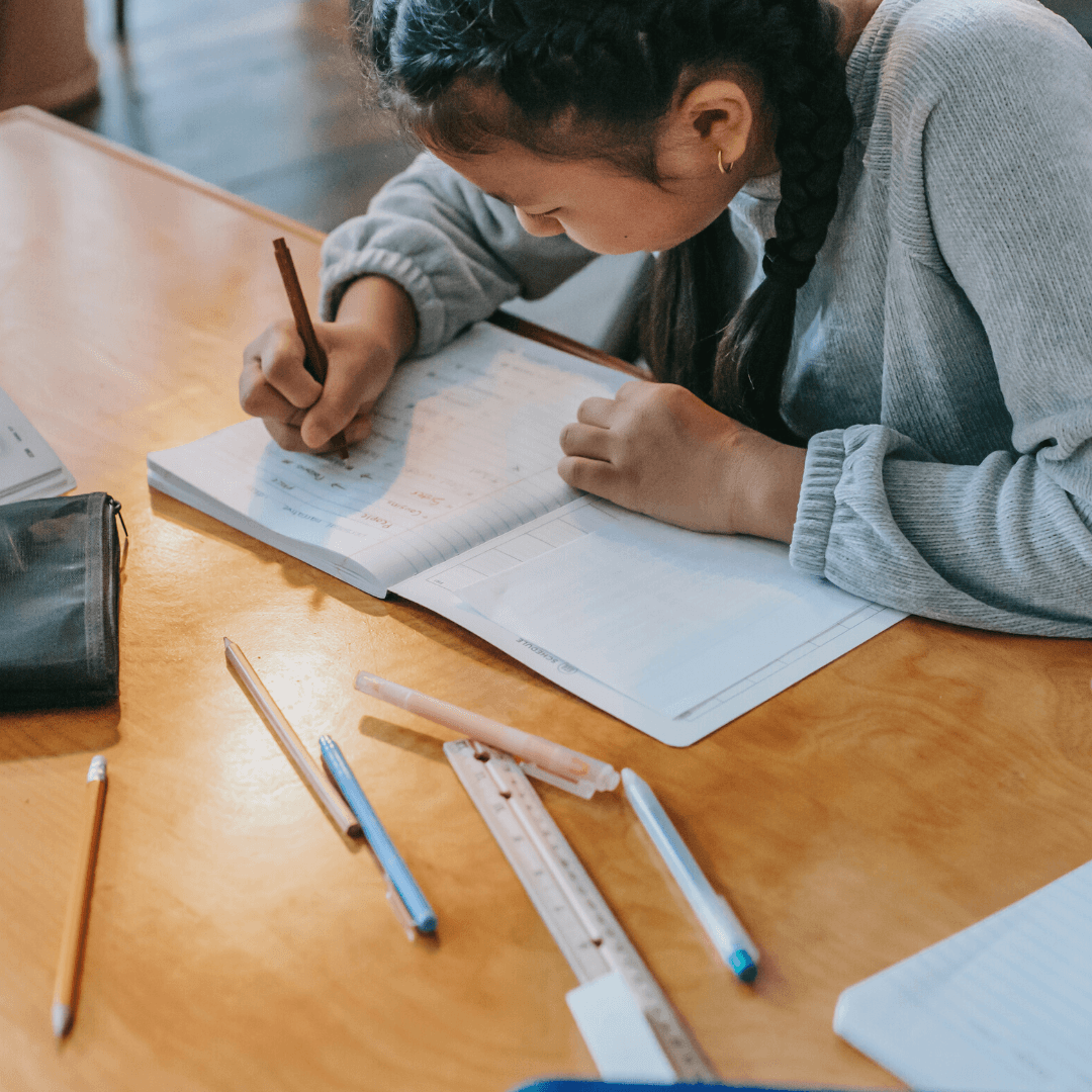 A student concentrating on her classwork